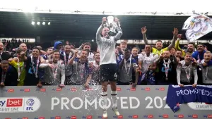 Derby’s Paul Warne taking his dog for a walk before promotion party can begin