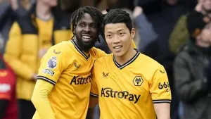 Wolves striker Hwang Hee-Chan, right, celebrates with team-mate Boubacar Traore after scoring against Luton (Nick Potts/PA)