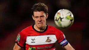 Ten-man Doncaster secure League Two play-off spot with draw at Gillingham