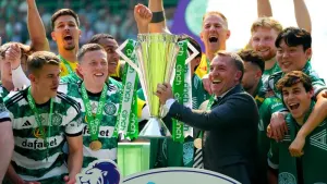 Celtic manager Brendan Rodgers celebrates with the cinch Premiership trophy (Andrew Milligan/PA)