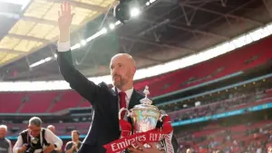 Manchester United manager Erik ten Hag celebrates with the FA Cup (John Walton/PA)