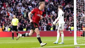 Rasmus Hojlund celebrates scoring the winning penalty against Coventry (Nick Potts/PA)