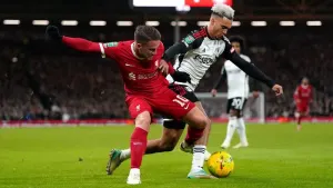 Liverpool’s Alexis Mac Allister (left) and Fulham’s Antonee Robinson battle for the ball during the Carabao Cup semi final s