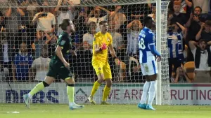 Hakon Valdimarsson saves late penalty as Brentford battle past Colchester