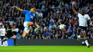 Cyriel Dessers leaps to volley in Rangers’ third goal against Dundee (Jane Barlow/PA)