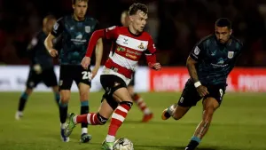 Kyle Hurst brings joy to Grant McCann in Doncaster’s win over Bradford