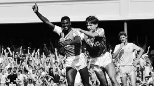 Paul Davis, left, has been given an award named after his former Arsenal team-mate Kevin Campbell (PA)