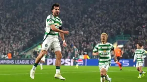 Celtic’s Nicolas Kuhn, left, celebrates scoring his second goal (Andrew Milligan/PA)