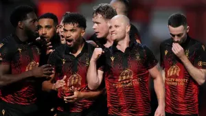Tamworth celebrate the winner against Huddersfield (Bradley Collyer/PA)