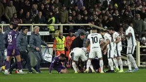 Fiorentina’s Edoardo Bove was surrounded by players after going down in the match against Inter Milan just past the quarter-