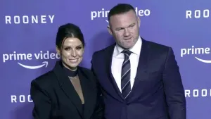 Coleen Rooney (left) has spoken of her family’s difficult ordeal after husband Wayne’s move to Manchester United (Danny Laws