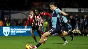 Late Aaron Morley penalty winner sends Wycombe top