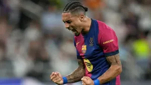 Raphinha scored twice in an action-packed 5-2 win for Barcelona over Real Madrid in the Super Cup (Altaf Qadri/AP)