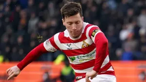 Doncaster boost bid for automatic promotion with narrow win at Accrington