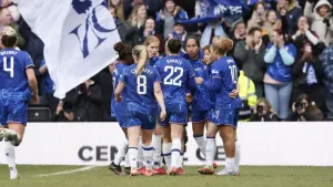 Chelsea players celebrate their side’s second goal at Pride Park (PA)