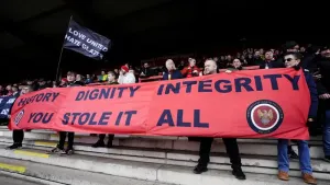 Supporters protest against the ownership of Manchester United during a match at Broadhurst Park (Nick Potts/PA)