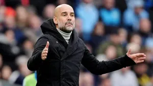 Pep Guardiola says he’s confident Manchester City will finish in the top four (Martin Rickett/PA)