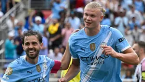 Erling Haaland, right, celebrated a milestone goal in his career in Orlando (Phelan Ebenhack/AP)