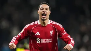 Liverpool hold off late challenge for dramatic win over nine-man Tottenham
