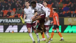 Hearts surge seven points clear after brushing aside nine-man Dundee United