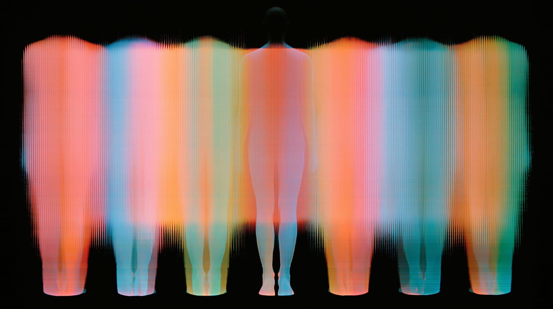 Futuristic image of a colourful computerized scan of several human forms in a row 
