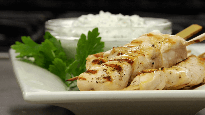Chicken Souvlaki on skewers on a dish