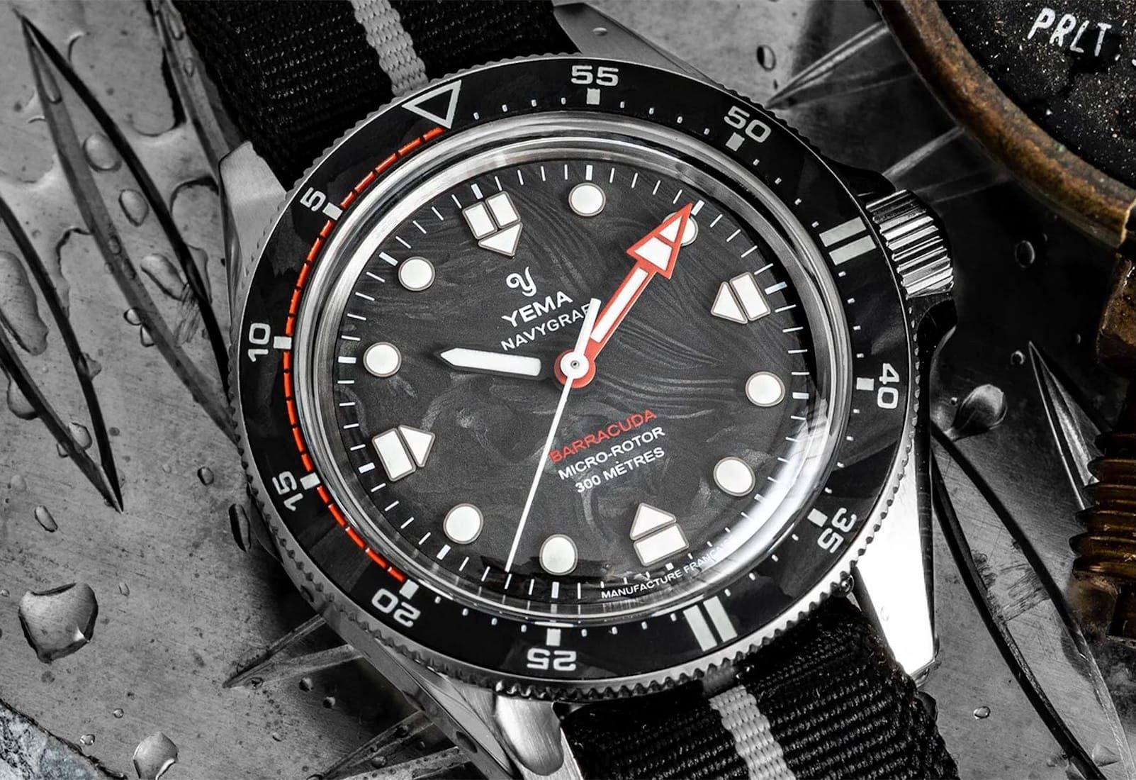 Yema Goes Submarine Hunting With a Forged Carbon Navygraf; Laco Shrinks The Frankfurt GMT; Nodus + Raven Bring The TrailTrekker Back; Benjamin James' Deerhurst Regulator; Two New America's Cup Panerai