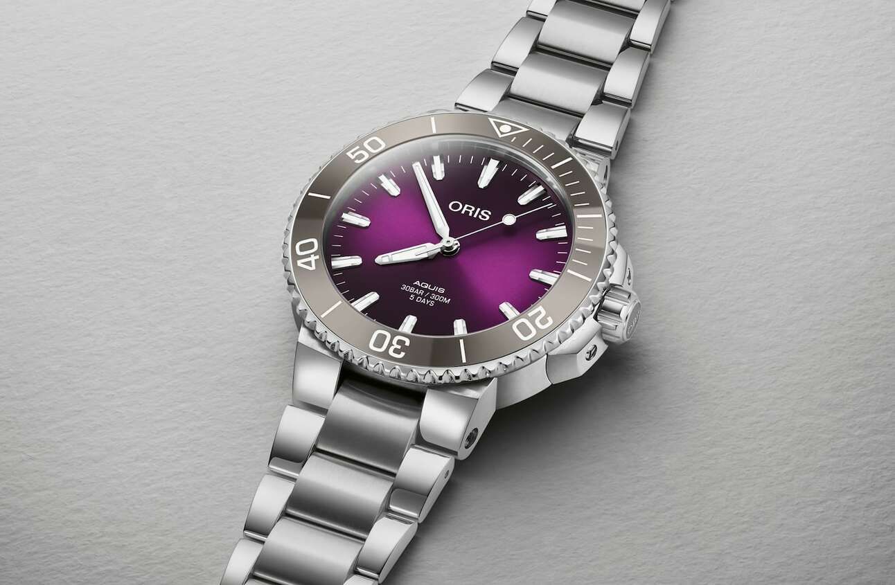 Oris Introduces A Very Purple Aquis, Hamilton Gives Groovy 70s Pan Europ Automatic The Ultimate 70s Color, IWC Slips White Dial Into The Mark XX And Arken Is A Fantastic Dual Time Affordable Watch