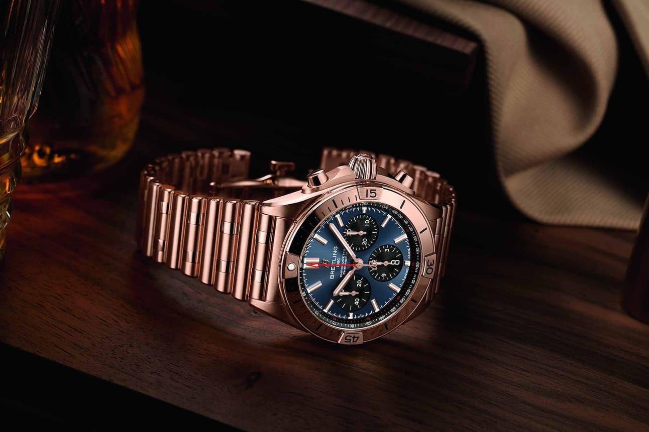 Breitling Releases Hefty Solid Gold Super Bowl-Themed Chronomat B01, Orient Stars Updates Flagship Moonphase, Swatch Pulls Another Bait-and-Switch With MoonSwatch, New From Bausele And Hublot