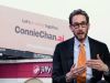 Composite image of Congressional candidate Scott Wiener gesticulating in front of a billboard that reads "let's do nothing together. ConnieChat.ai" 