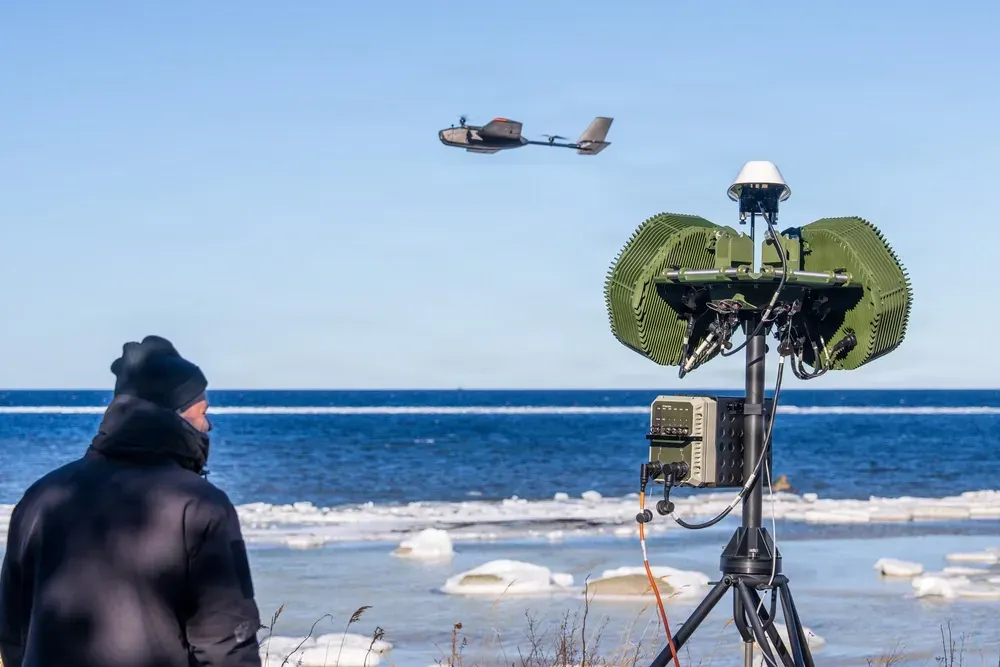 Defense industry representative tests an air defense system during a multinational exercise in Estonia.