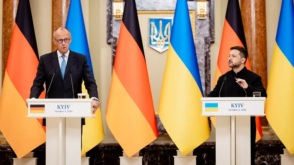 Friedrich Merz and Volodymyr Zelenskyy at a Kyiv press conference announcing Germany’s Ukraine support package.