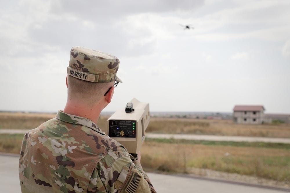 U.S. Army soldier operating a handheld counter-drone system during military training at Mihail Kogălniceanu Air Base, Romania.