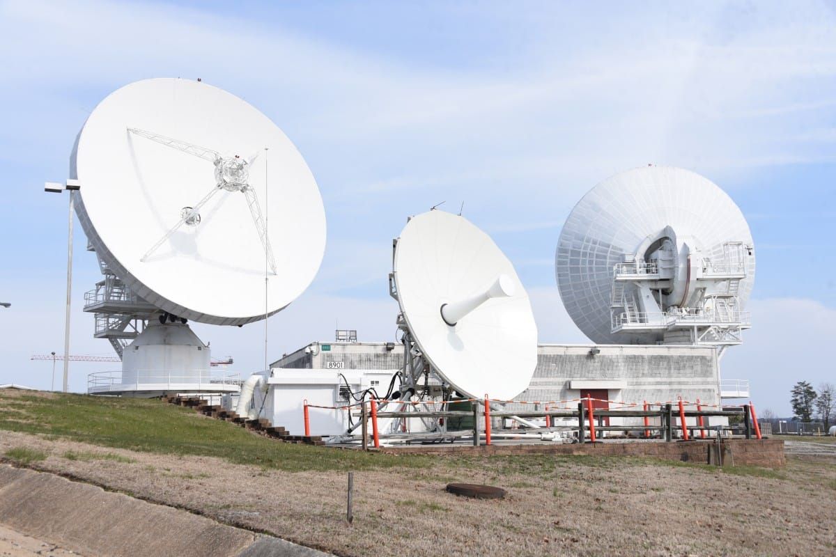 U.S. Army satellite communications ground station with large parabolic antennas.