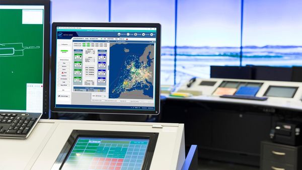 EUROCONTROL ARTAS V9 air traffic surveillance system displayed on a control room monitor.
