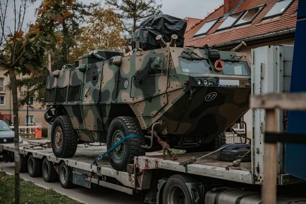 Polish-made LOTR Kleszcz 4x4 armored reconnaissance vehicle secured on a transport trailer during delivery to the Polish Army.