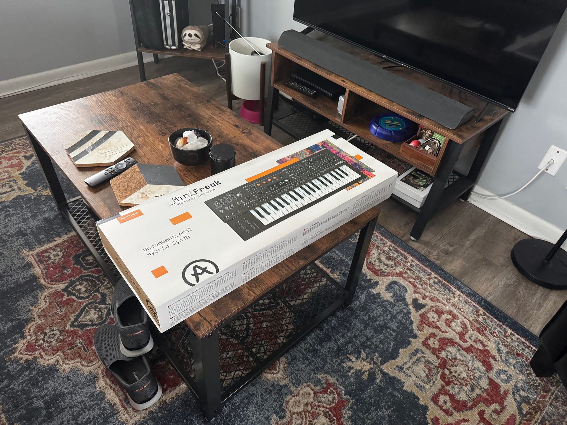 An unboxed Arturia Minifreak on the coffee table