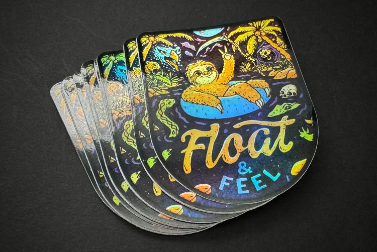 Sloth sicker, with a holographic finish, text reads: Float & Feel