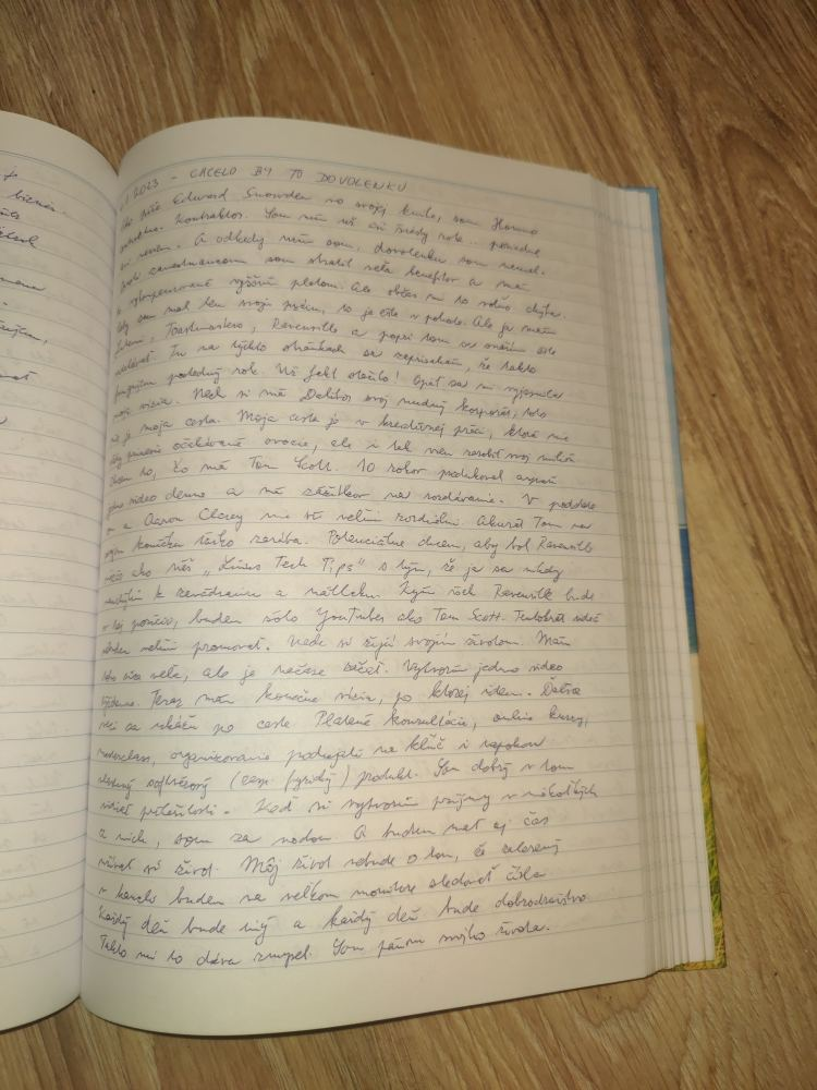 Open handwritten journal on a wooden floor, representing the private writing phase after the public archive was taken down.