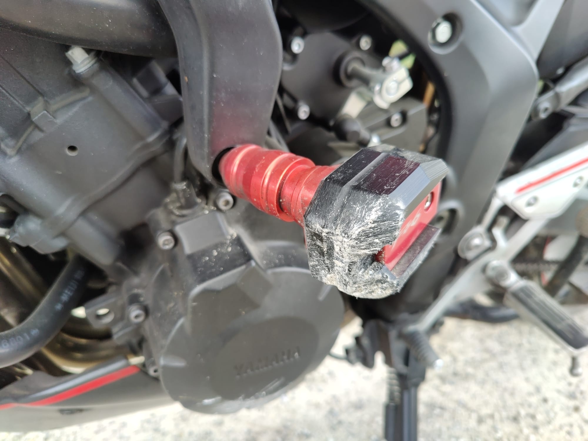 Scraped crash bar on the left side of the Yamaha Fazer after the fall.