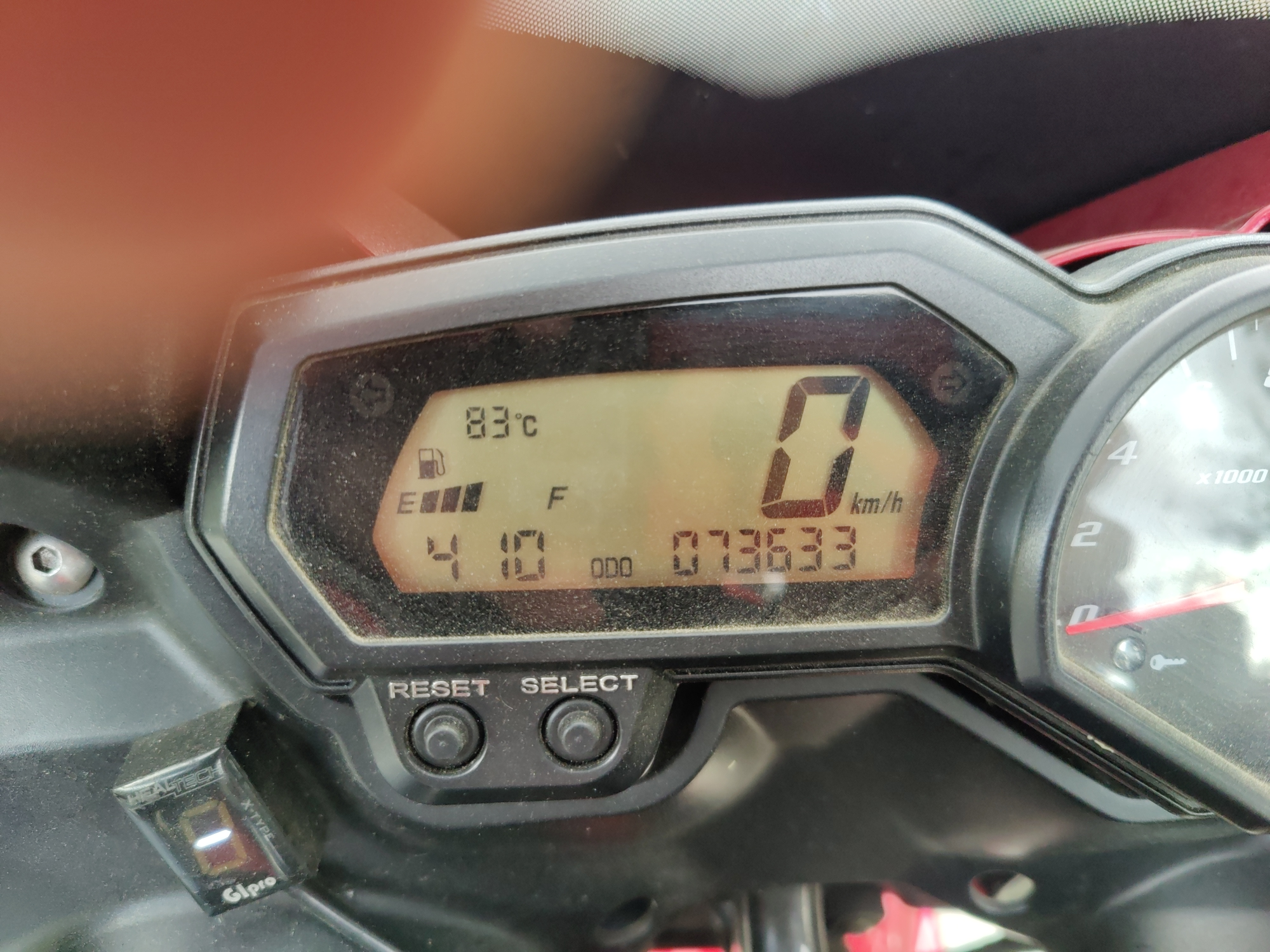 Close-up of the Yamaha Fazer dashboard with digital display and analog tachometer.