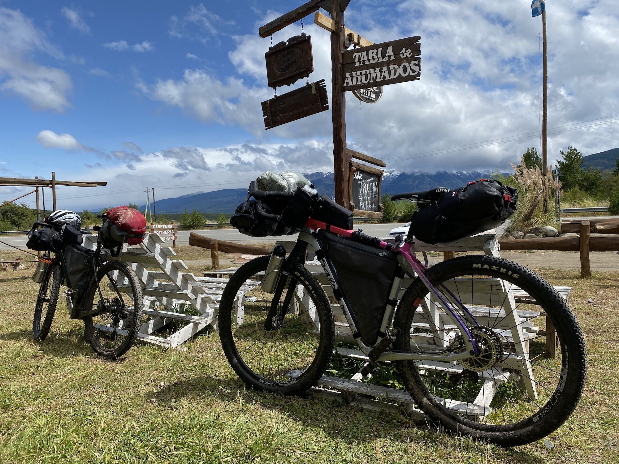 Bikes leaning against chairs, blue sky behind