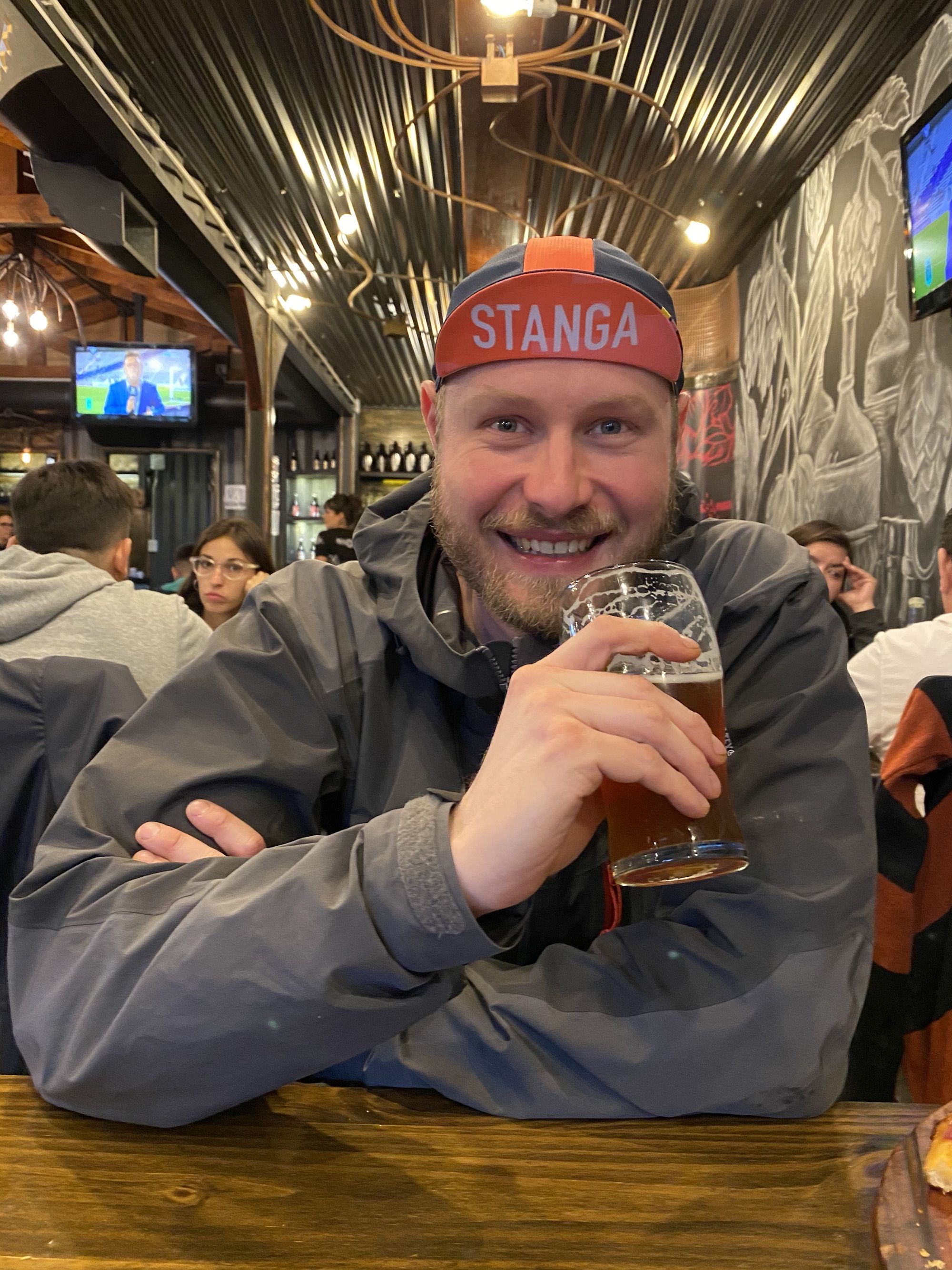A happy man with a beer. 