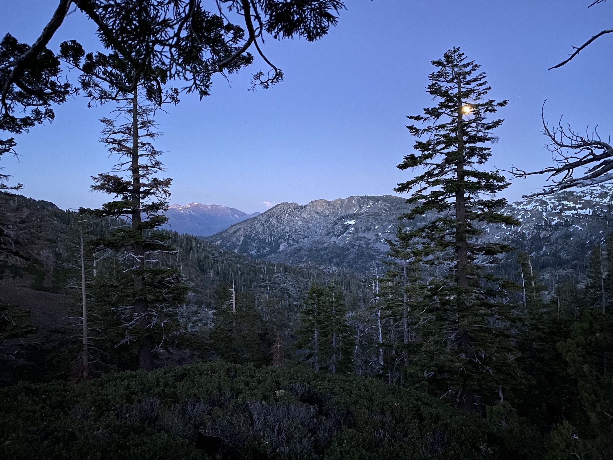 The last light illuminating mountains in the distance