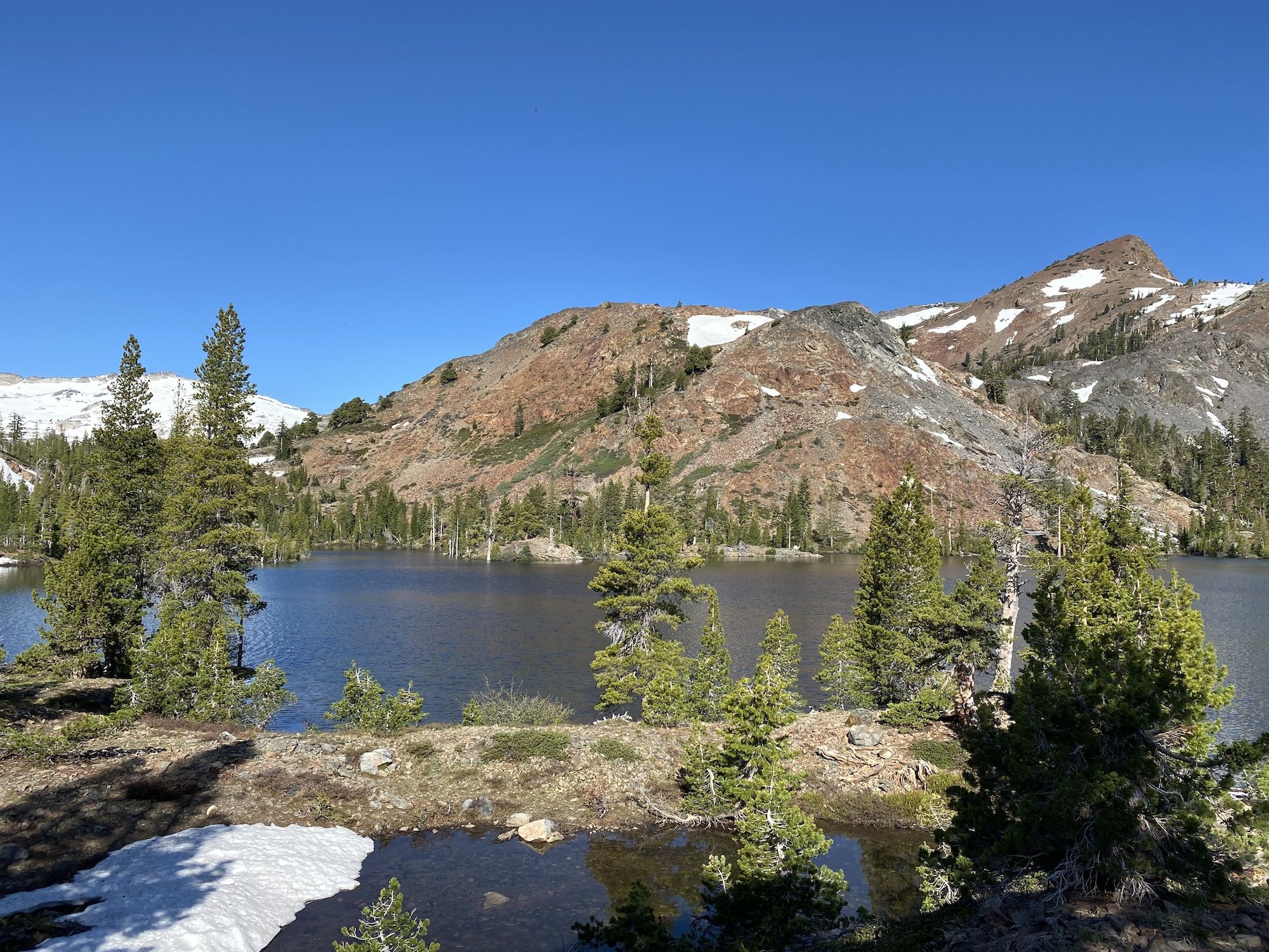 Red mountains on the other side of Susie Lake