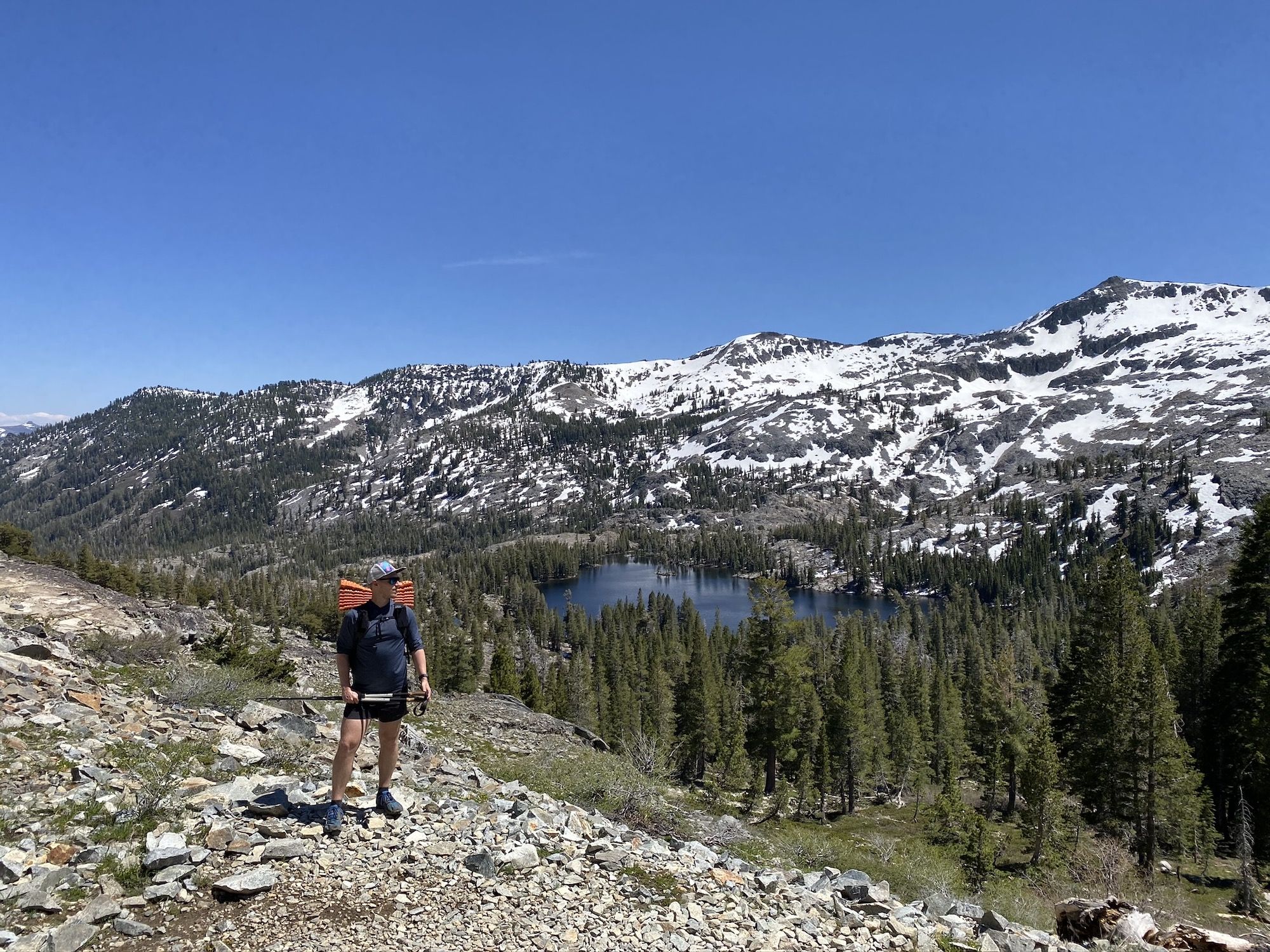 Hiker looking out over a mountain landscape