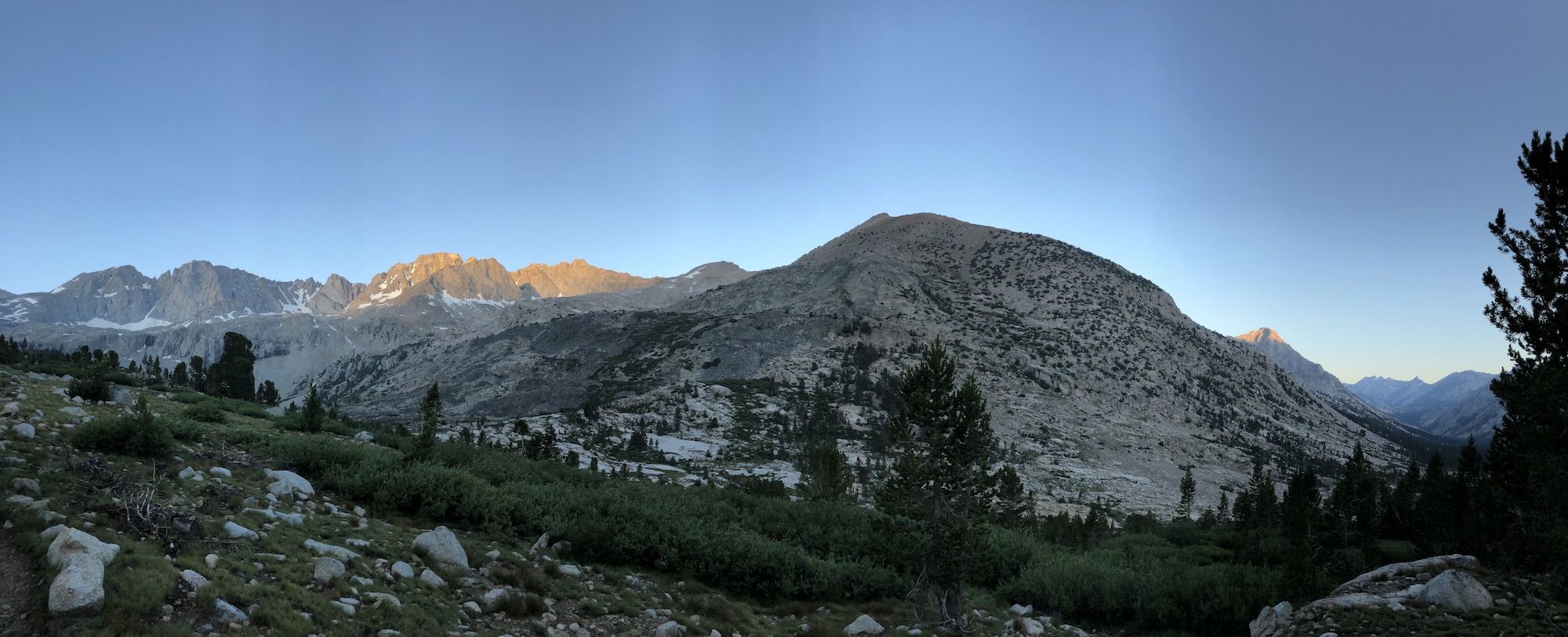 Morning sun lighting up mountains in the distance