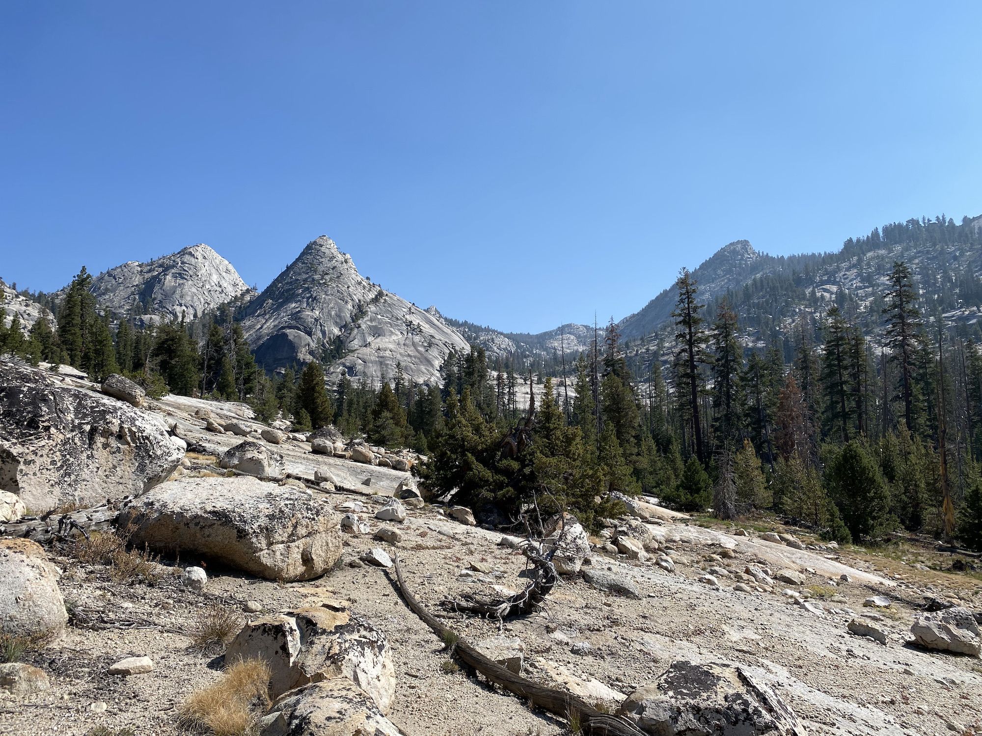 Bare granite mountains surrounding a valley.