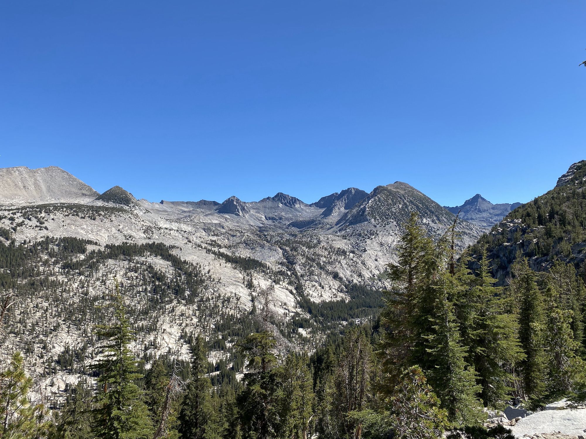 Granite peaks with forest.