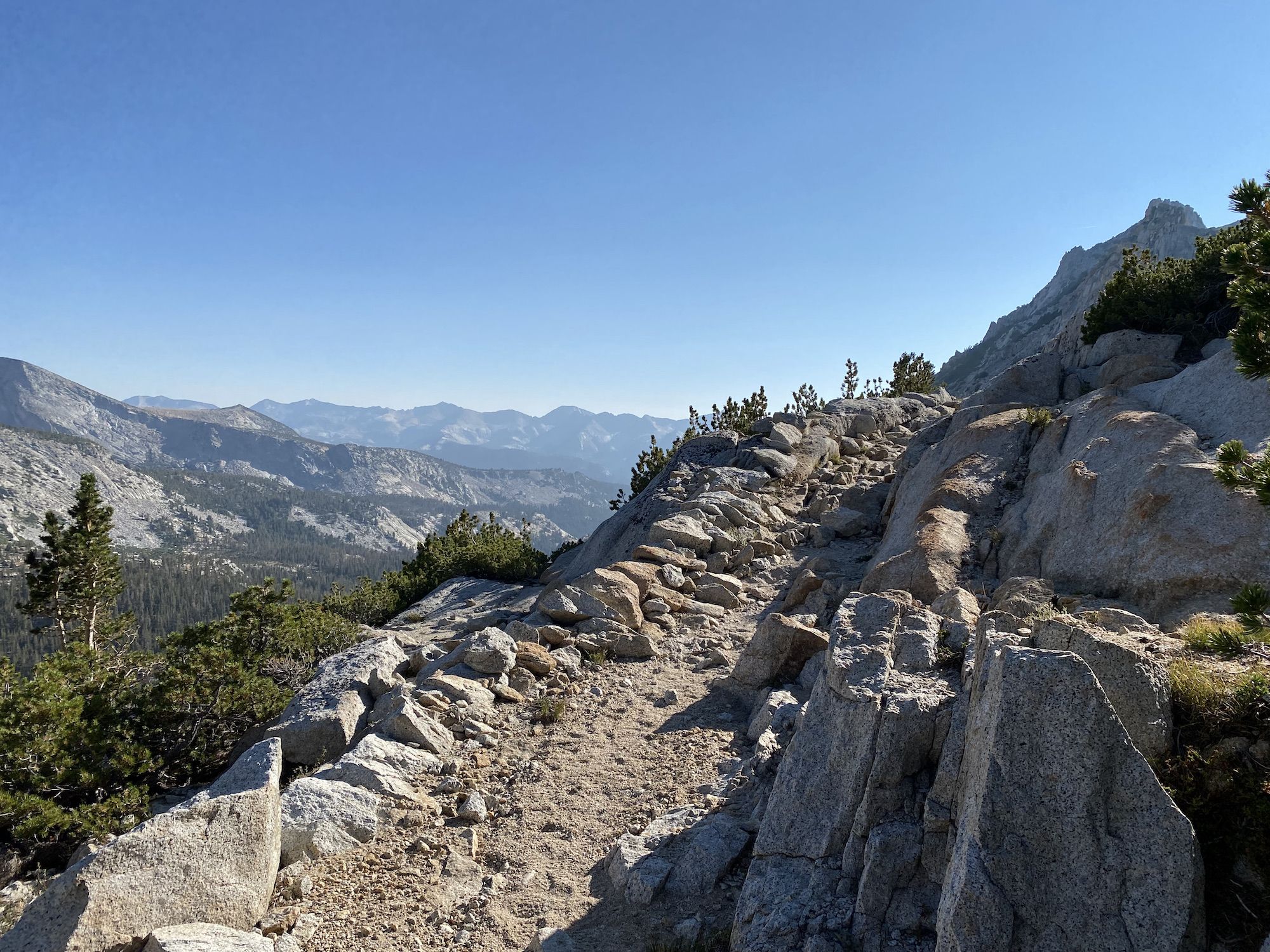 A rocky trail with a sheer drop on the left side.